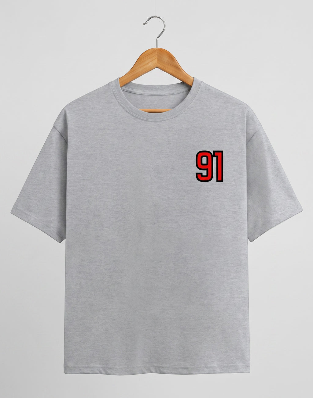 91 Varsity Left Chest graphic t-shirt on GREY unisex classic crew soft-touch 180 GSM cotton, bold red varsity 91 left-chest pocket print signature, black outline varsity number, minimalist placement subtle distinctive, classic crew neckline timeless, unisex regular fit flattering, pre-shrunk bio-washed maintains shape