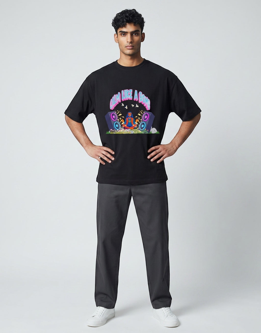 Calm Like A Bomb graphic t-shirt on black unisex 100% cotton crew neck, featuring meditative figure with retro speakers, DTG print 300 DPI