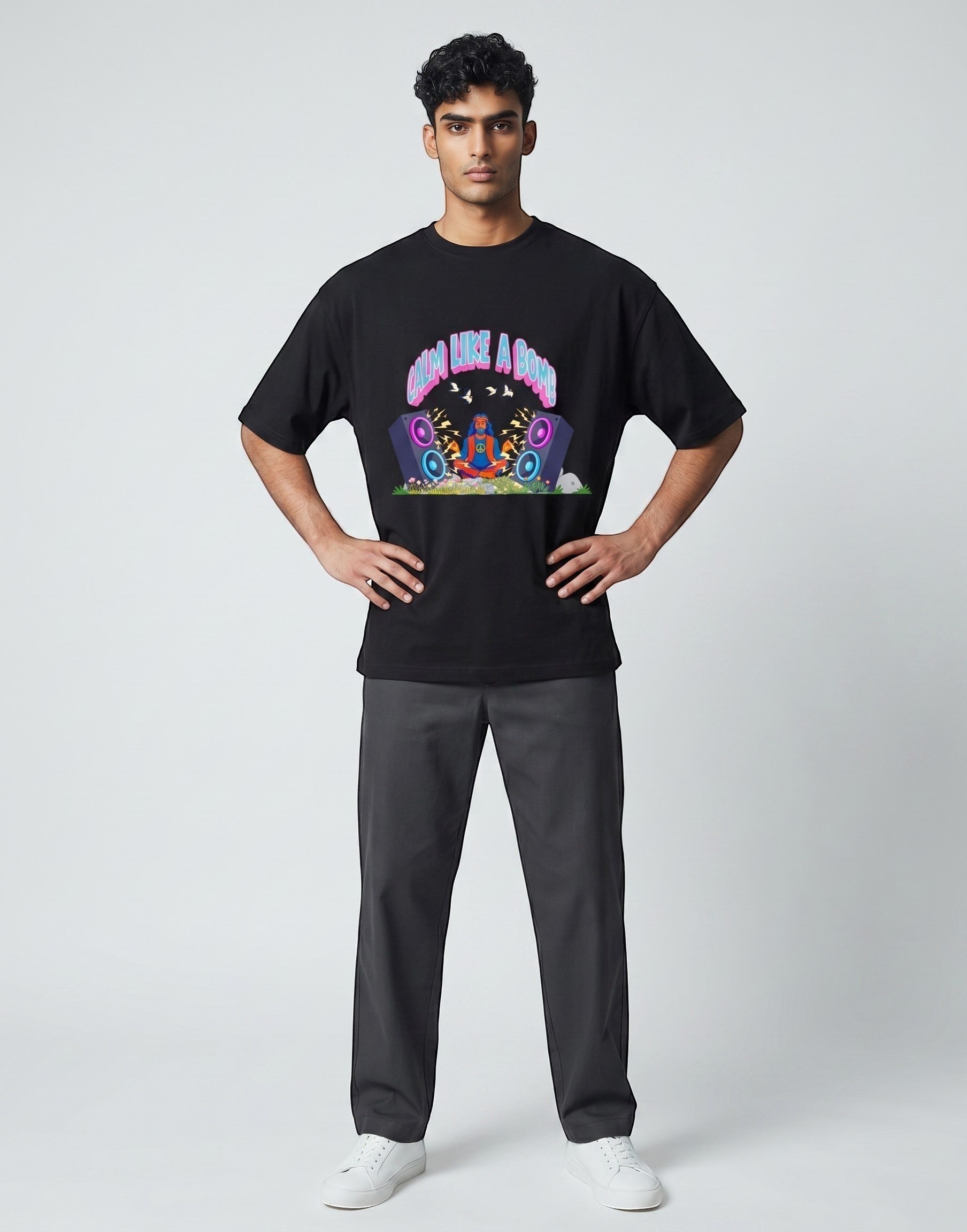 Calm Like A Bomb graphic t-shirt on black unisex 100% cotton crew neck, featuring meditative figure with retro speakers, DTG print 300 DPI