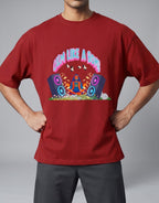 Calm Like A Bomb graphic t-shirt on red unisex 100% cotton crew neck, featuring meditative figure with retro speakers, DTG print 300 DPI