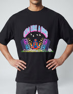 Calm Like A Bomb graphic t-shirt on black unisex 100% cotton crew neck, featuring meditative figure with retro speakers, DTG print 300 DPI