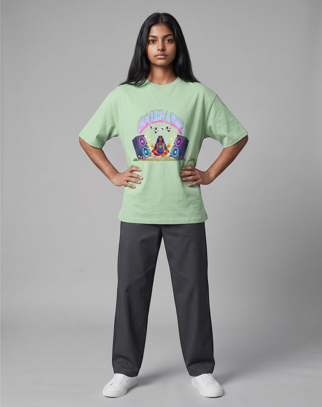 Calm Like A Bomb graphic t-shirt on jade unisex 100% cotton crew neck, featuring meditative figure with retro speakers, DTG print 300 DPI
