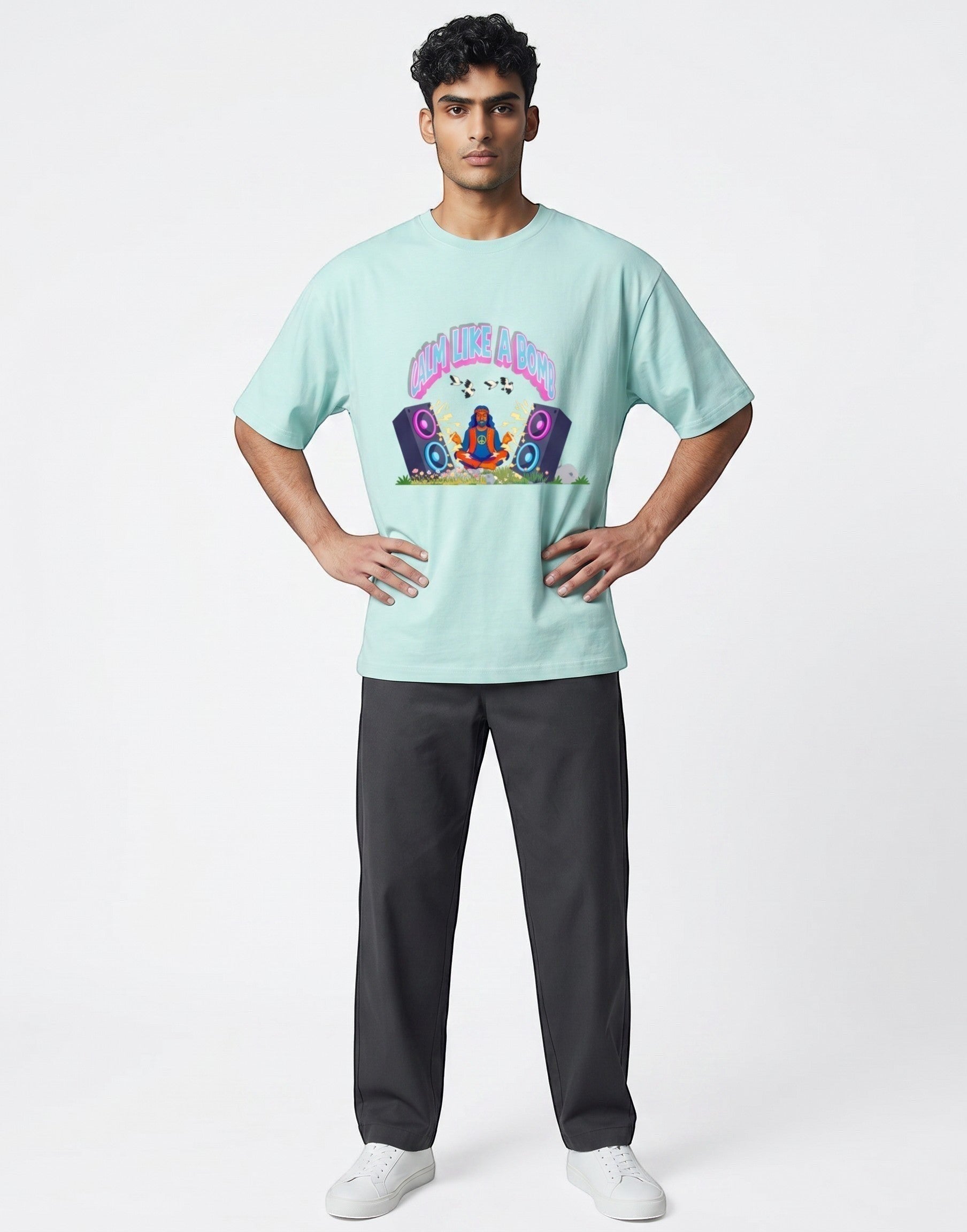 Calm Like A Bomb graphic t-shirt on mint unisex 100% cotton crew neck, featuring meditative figure with retro speakers, DTG print 300 DPI