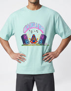 Calm Like A Bomb graphic t-shirt on mint unisex 100% cotton crew neck, featuring meditative figure with retro speakers, DTG print 300 DPI