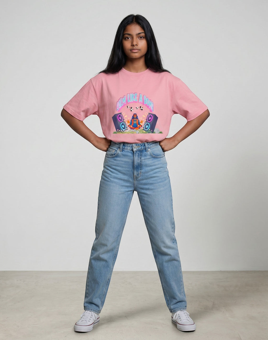 Calm Like A Bomb graphic t-shirt on pink flamingo unisex 100% cotton crew neck, featuring meditative figure with retro speakers, DTG print 300 DPI