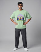 Calm Like A Bomb graphic t-shirt on jade unisex 100% cotton crew neck, featuring meditative figure with retro speakers, DTG print 300 DPI