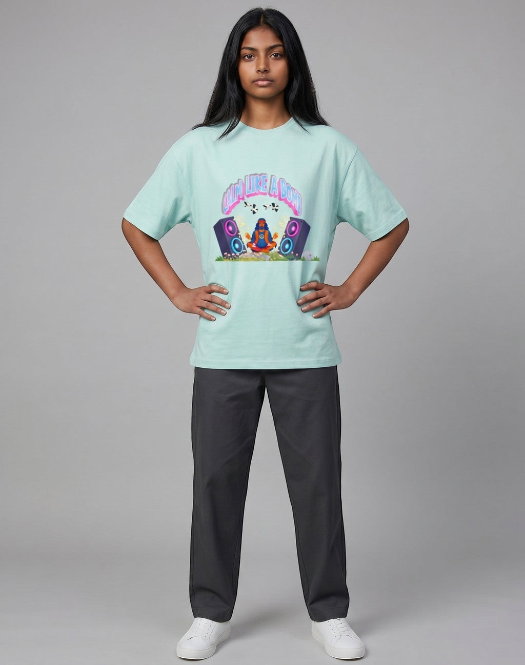 Calm Like A Bomb graphic t-shirt on mint  unisex 100% cotton crew neck, featuring meditative figure with retro speakers, DTG print 300 DPI