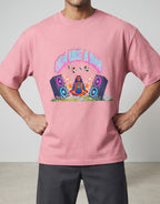 Calm Like A Bomb graphic t-shirt on pink flamingo unisex 100% cotton crew neck, featuring meditative figure with retro speakers, DTG print 300 DPI