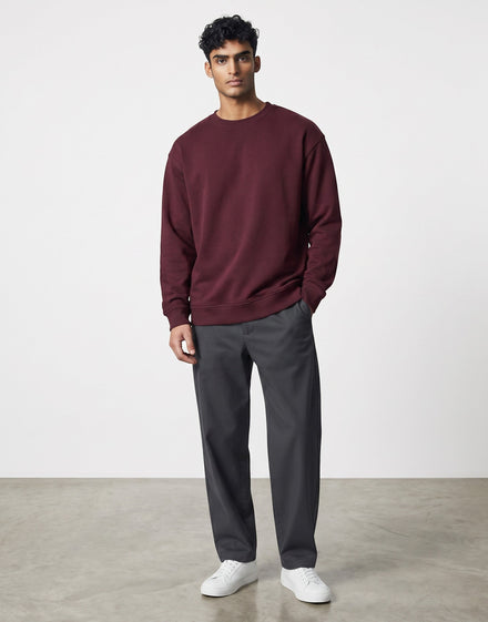 Burgundy Oversized Sweatshirt on BURGUNDY unisex premium soft-touch cotton blend crew neck, relaxed roomy fit modern streetwear aesthetic, deep rich burgundy hue sophisticated, durable ribbed cuffs hem cozy secure, classic crew neckline, oversized silhouette gender-neutral, timeless style