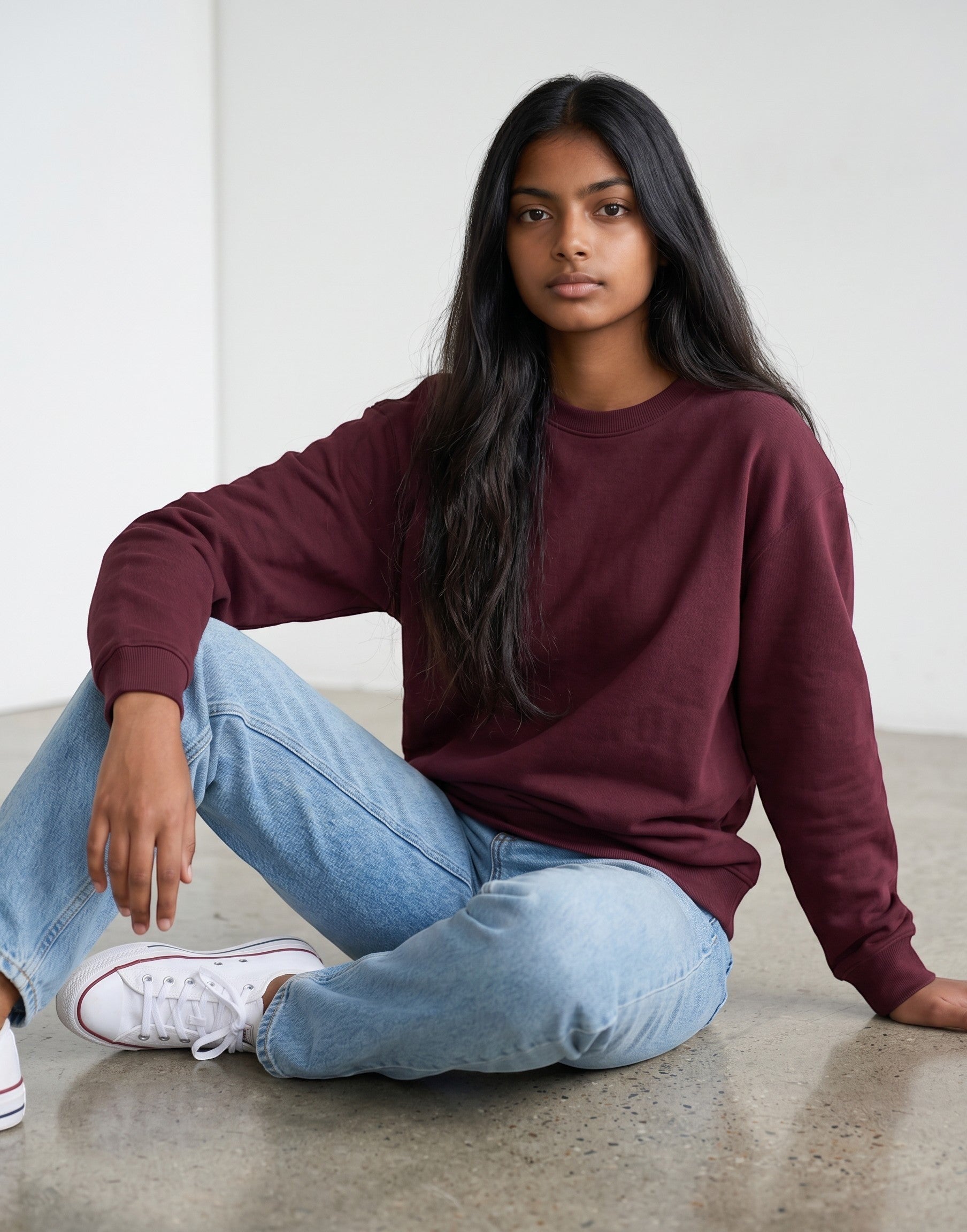 Burgundy Oversized Sweatshirt on BURGUNDY unisex premium soft-touch cotton blend crew neck, relaxed roomy fit modern streetwear aesthetic, deep rich burgundy hue sophisticated, durable ribbed cuffs hem cozy secure, classic crew neckline, oversized silhouette gender-neutral, timeless style