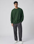 Forest Green Oversized Sweatshirt on FOREST GREEN unisex premium soft-touch fabric crew neck, relaxed roomy fit modern aesthetic, deep rich forest green hue sophisticated, ribbed cuffs hem durable, classic crew neck design, oversized silhouette minimalist look