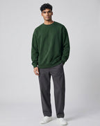 Forest Green Oversized Sweatshirt on FOREST GREEN unisex premium soft-touch fabric crew neck, relaxed roomy fit modern aesthetic, deep rich forest green hue sophisticated, ribbed cuffs hem durable, classic crew neck design, oversized silhouette minimalist look