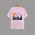 Halloween Graveyard graphic t-shirt on PINK unisex 100% cotton crew neck, vibrant detailed haunted graveyard scene with witches pumpkins glowing full moon, spooky Halloween design, DTG print 300 DPI, 180 GSM breathable soft fabric