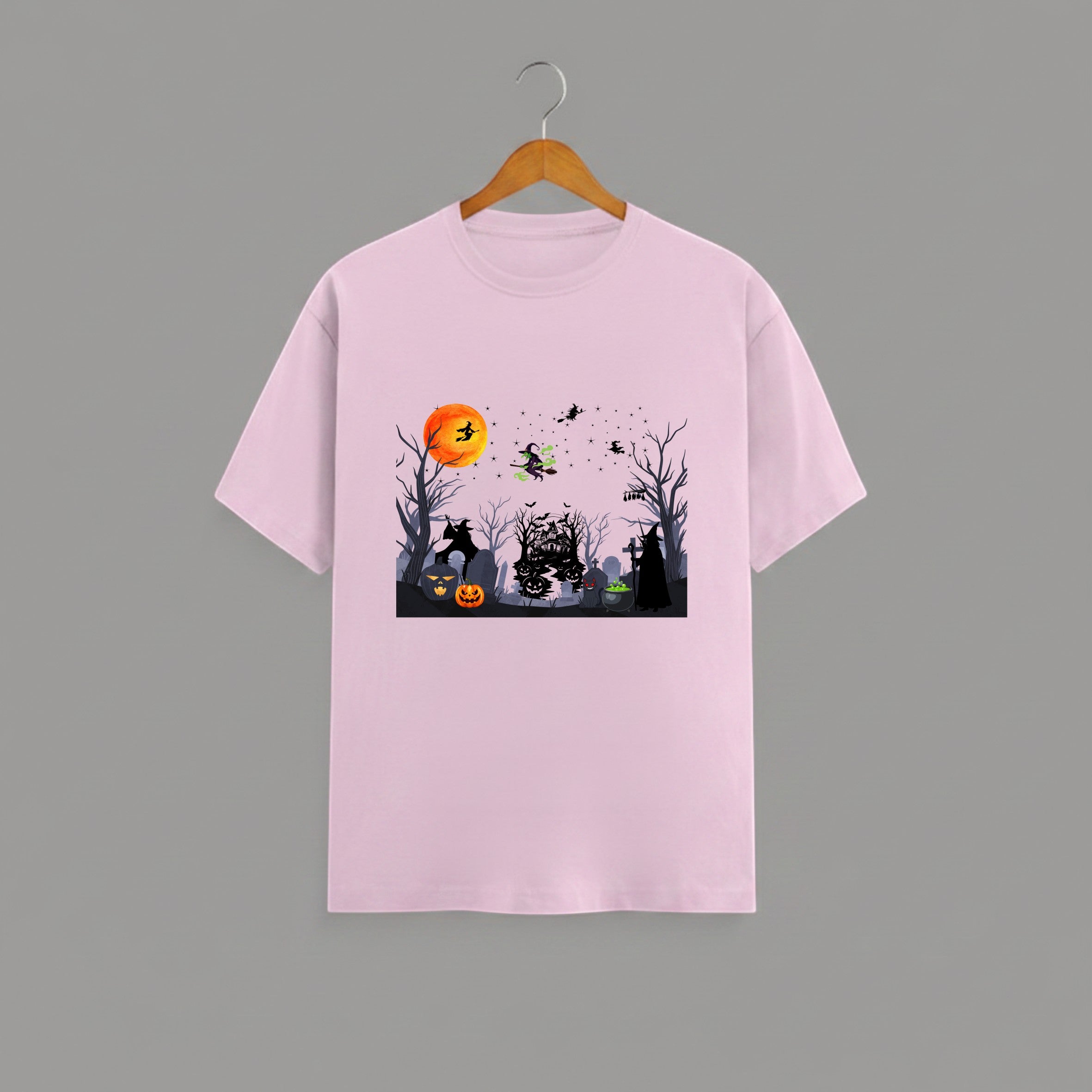 Halloween Graveyard graphic t-shirt on PINK unisex 100% cotton crew neck, vibrant detailed haunted graveyard scene with witches pumpkins glowing full moon, spooky Halloween design, DTG print 300 DPI, 180 GSM breathable soft fabric
