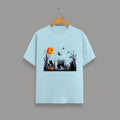 Halloween Graveyard graphic t-shirt on BABY BLUE unisex 100% cotton crew neck, vibrant detailed haunted graveyard scene with witches pumpkins glowing full moon, spooky Halloween design, DTG print 300 DPI, 180 GSM breathable soft fabric