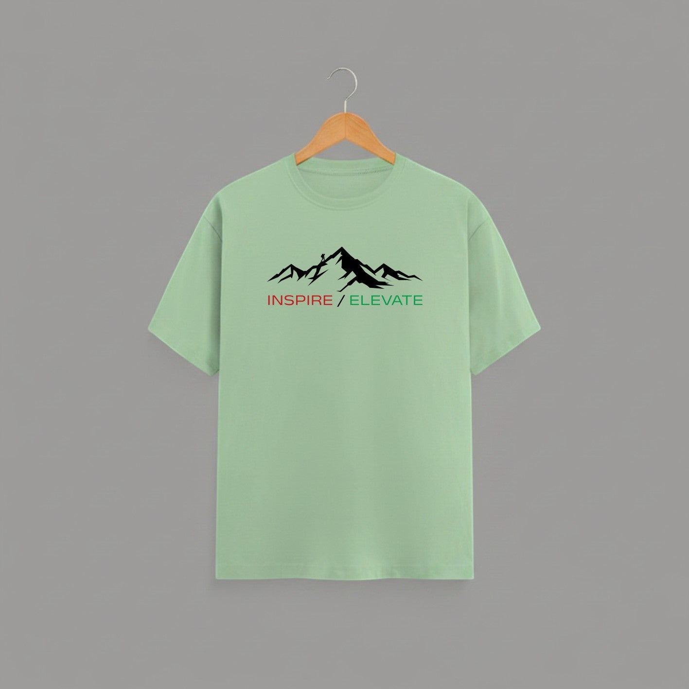 Inspire Elevate Mountain graphic t-shirt on JADE GREEN unisex 100% cotton crew neck, striking mountain graphic with INSPIRE / ELEVATE empowering message, motivational goals design, DTG print 300 DPI, 180 GSM breathable soft fabric