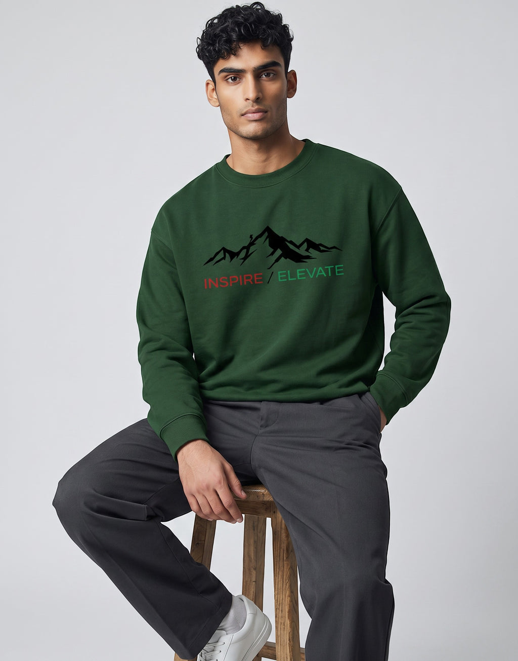 Inspire Elevate Mountain Oversized Sweatshirt on FOREST GREEN unisex premium soft-touch fabric blend, relaxed cozy fit feels great all day, bold mountain-inspired graphic chest INSPIRE ELEVATE message, ribbed cuffs timeless look, classic crew neck design, oversized fit maximum comfort, versatile unisex design all body types, unique eye-catching graphic print