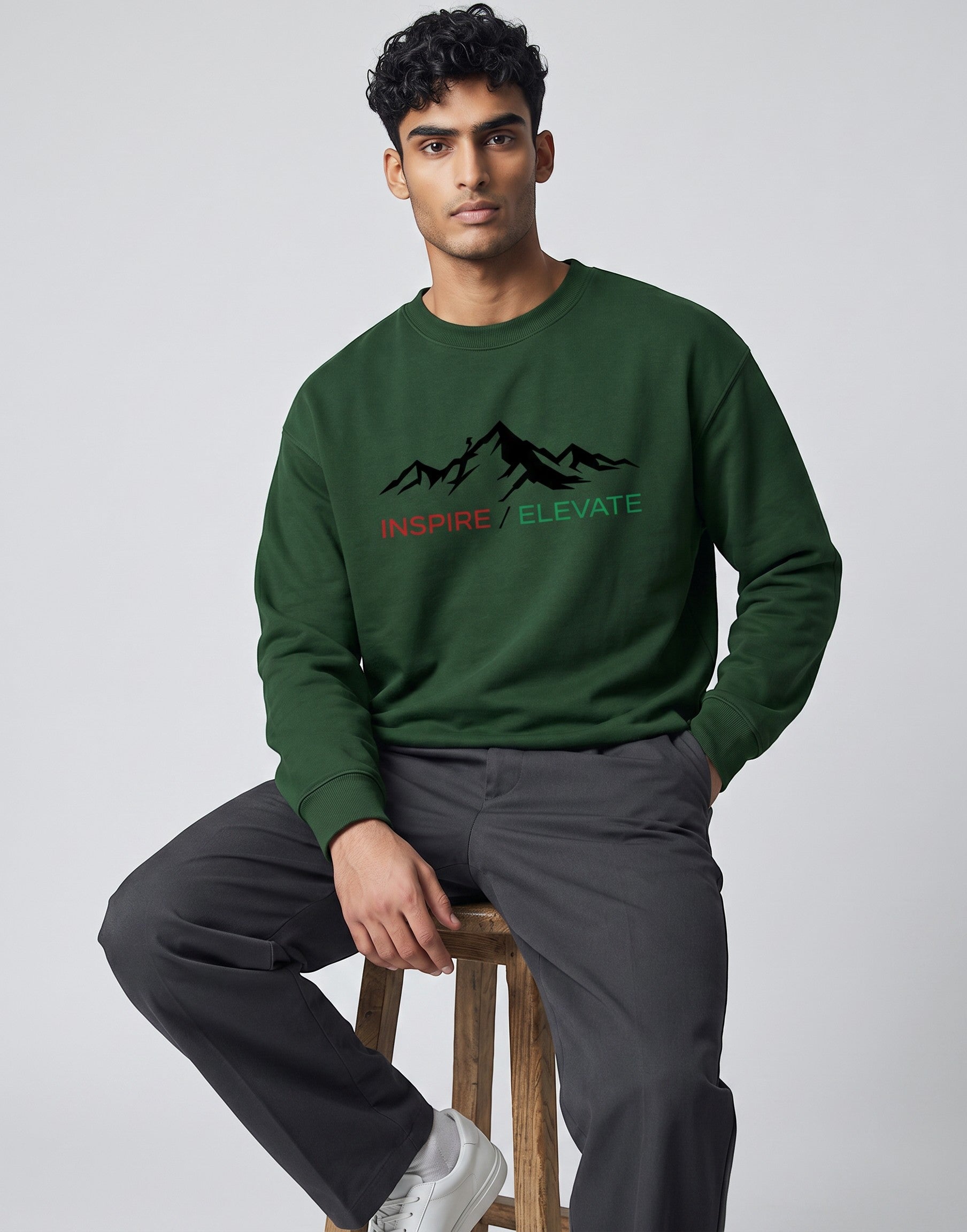 Inspire Elevate Mountain Oversized Sweatshirt on FOREST GREEN unisex premium soft-touch fabric blend, relaxed cozy fit feels great all day, bold mountain-inspired graphic chest INSPIRE ELEVATE message, ribbed cuffs timeless look, classic crew neck design, oversized fit maximum comfort, versatile unisex design all body types, unique eye-catching graphic print