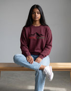 Inspire Elevate Mountain Oversized Sweatshirt on MAROON unisex premium soft-touch fabric blend, relaxed cozy fit feels great all day, bold mountain-inspired graphic chest INSPIRE ELEVATE message, ribbed cuffs timeless look, classic crew neck design, oversized fit maximum comfort, versatile unisex design all body types, unique eye-catching graphic print