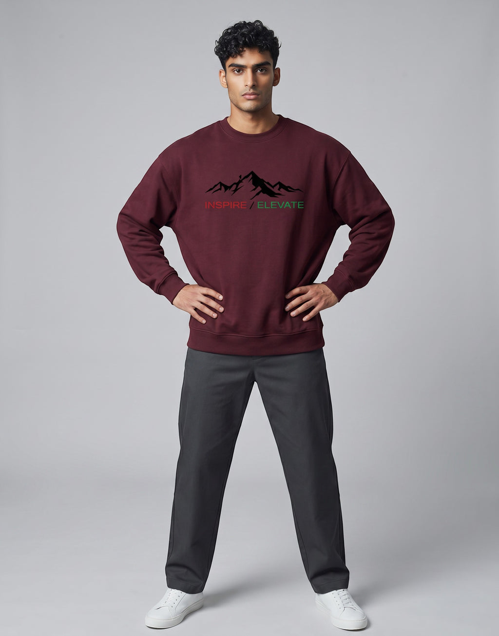 Inspire Elevate Mountain Oversized Sweatshirt on MAROON unisex premium soft-touch fabric blend, relaxed cozy fit feels great all day, bold mountain-inspired graphic chest INSPIRE ELEVATE message, ribbed cuffs timeless look, classic crew neck design, oversized fit maximum comfort, versatile unisex design all body types, unique eye-catching graphic print