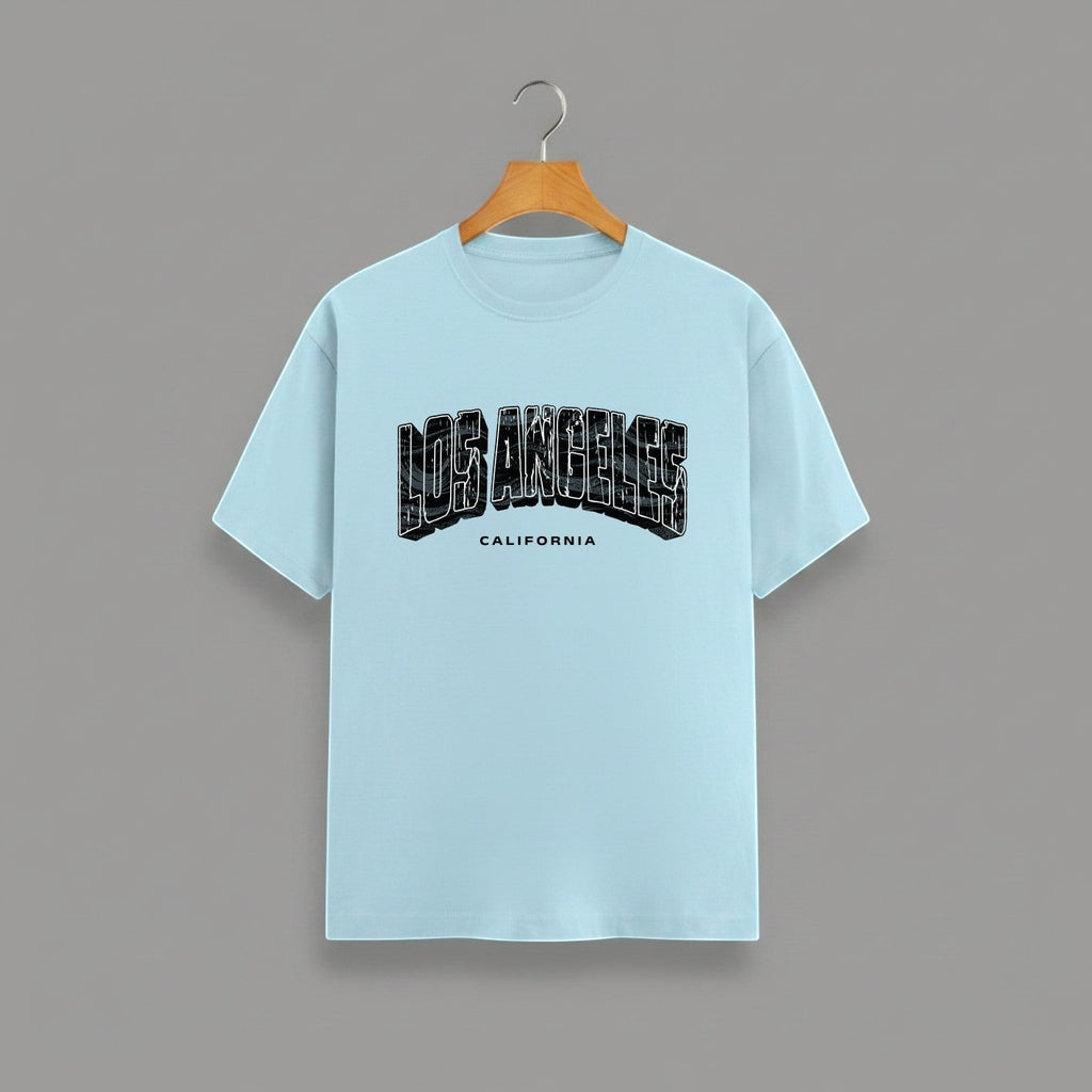Los Angeles California graphic t-shirt on BABY BLUE unisex classic crew soft-touch 180 GSM cotton, distressed LOS ANGELES collegiate arch lettering bold CA graphic, California subtitle clean spaced caps, monochrome black-on-white minimal versatile, classic crew neckline timeless, unisex regular fit flattering, pre-shrunk bio-washed maintains shape
