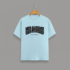 Los Angeles California graphic t-shirt on BABY BLUE unisex classic crew soft-touch 180 GSM cotton, distressed LOS ANGELES collegiate arch lettering bold CA graphic, California subtitle clean spaced caps, monochrome black-on-white minimal versatile, classic crew neckline timeless, unisex regular fit flattering, pre-shrunk bio-washed maintains shape