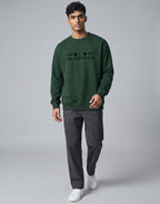 Lunar-Inspired Graphic Oversized Sweatshirt on FOREST GREEN unisex premium soft-touch fabric blend, relaxed oversized fit modern silhouette, unique lunar-inspired graphic chest celebrating love moon, ribbed crew neckline cuffs hem structured, clean minimalist aesthetic, contemporary look, unisex timeless inclusive style, premium durable fabric soft skin