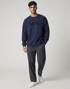 Lunar-Inspired Graphic Oversized Sweatshirt on NAVY BLUE unisex premium soft-touch fabric blend, relaxed oversized fit modern silhouette, unique lunar-inspired graphic chest celebrating love moon, ribbed crew neckline cuffs hem structured, clean minimalist aesthetic, contemporary look, unisex timeless inclusive style, premium durable fabric soft skin