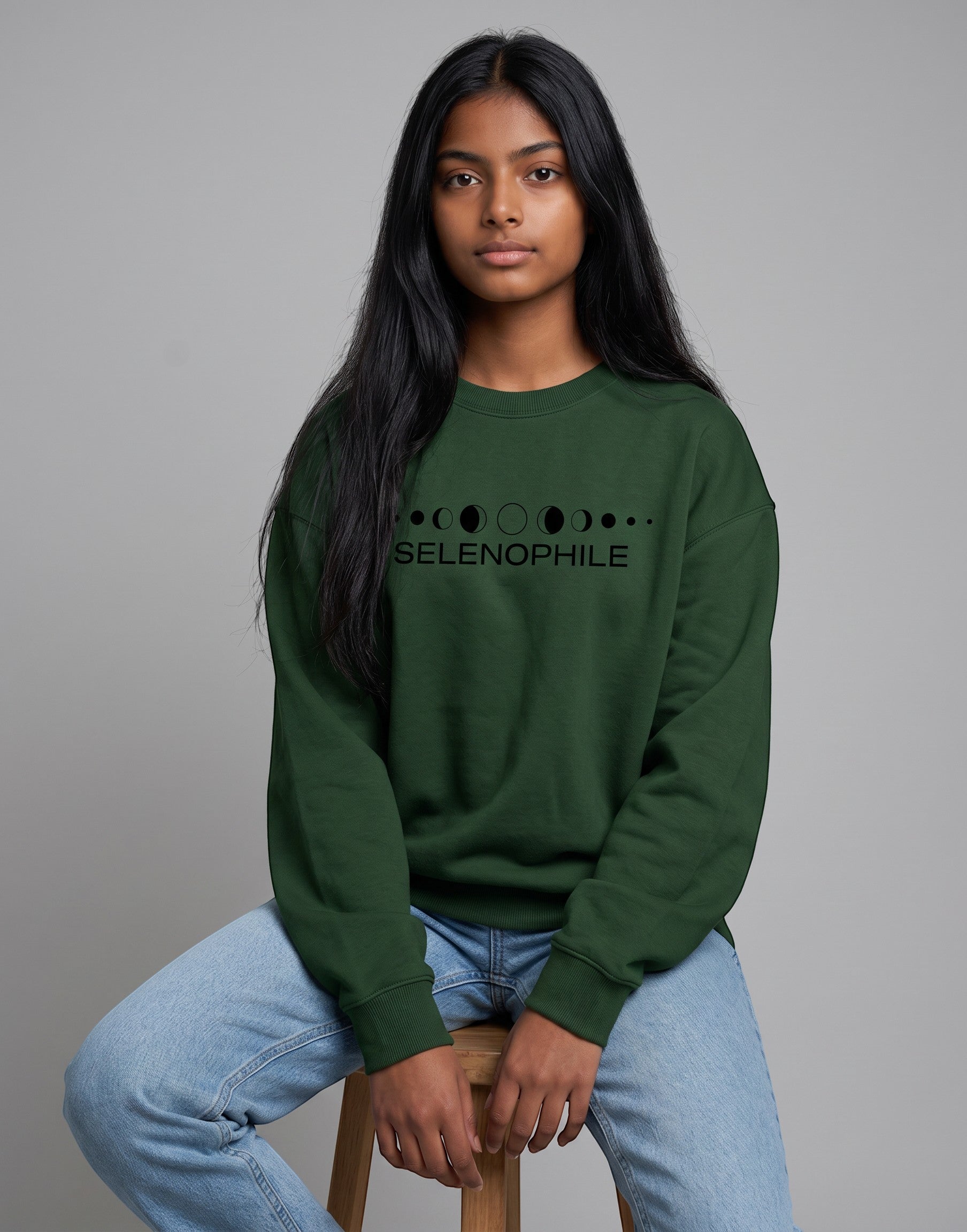 Lunar-Inspired Graphic Oversized Sweatshirt on FOREST GREEN unisex premium soft-touch fabric blend, relaxed oversized fit modern silhouette, unique lunar-inspired graphic chest celebrating love moon, ribbed crew neckline cuffs hem structured, clean minimalist aesthetic, contemporary look, unisex timeless inclusive style, premium durable fabric soft skin
