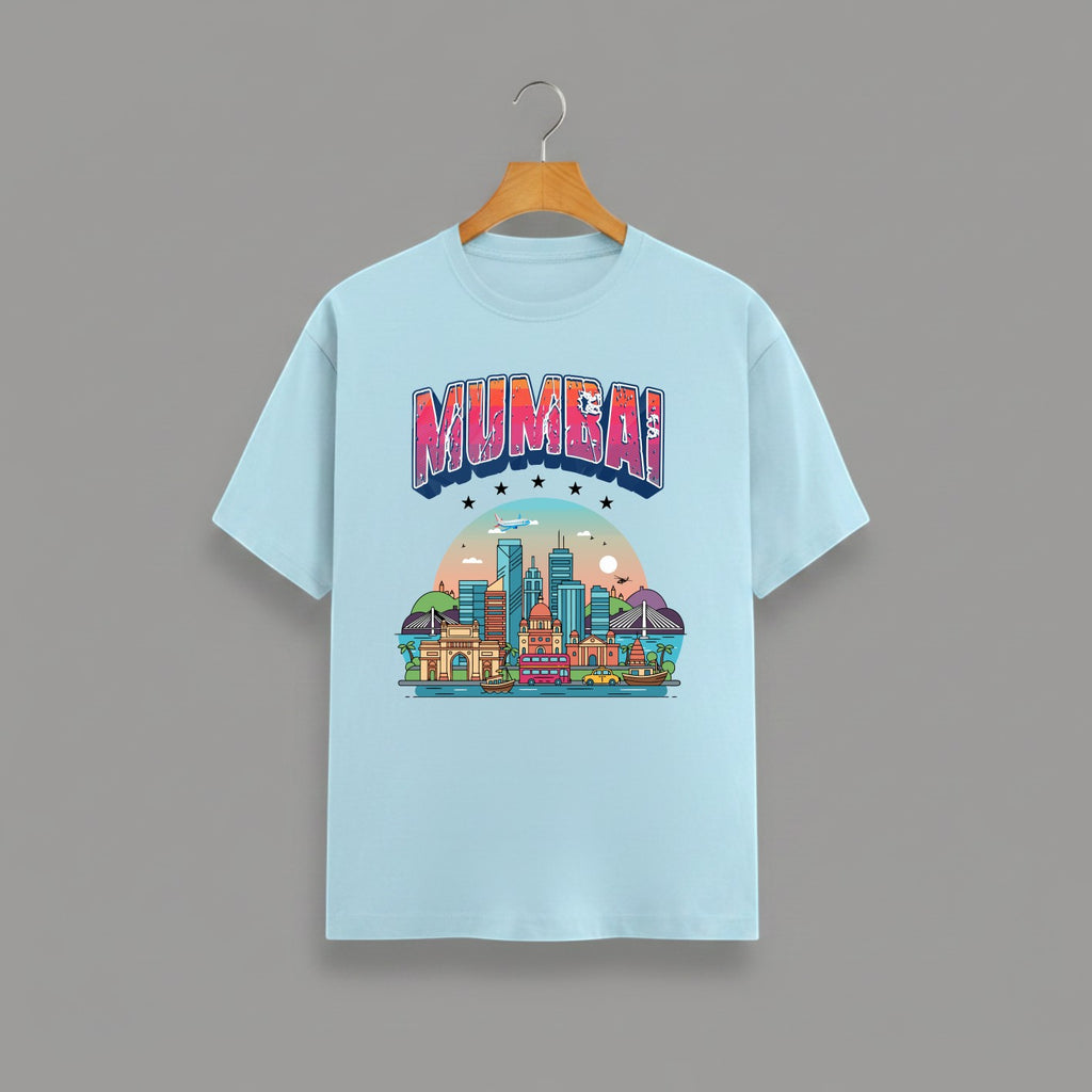 Mumbai Meri Jaan graphic t-shirt with bold MUMBAI lettering, BABY BLUE vibrant skyline artwork, Gateway of India and Bandra-Worli Sea Link city landmarks, unisex classic crew fit, soft 180 GSM cotton tee