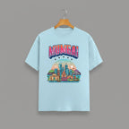 Mumbai Meri Jaan graphic t-shirt with bold MUMBAI lettering, BABY BLUE vibrant skyline artwork, Gateway of India and Bandra-Worli Sea Link city landmarks, unisex classic crew fit, soft 180 GSM cotton tee