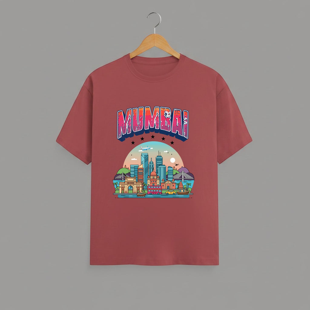 Mumbai Meri Jaan graphic t-shirt with bold MUMBAI lettering, CORAL vibrant skyline artwork, Gateway of India and Bandra-Worli Sea Link city landmarks, unisex classic crew fit, soft 180 GSM cotton tee