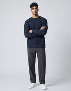 Navy Oversized Sweatshirt on NAVY unisex premium soft-touch cotton blend crew neck, relaxed roomy fit heritage-inspired character, subtle V-stitch detailing collar, durable ribbed crew neckline cuffs hem, classic navy hue timeless aesthetic, oversized silhouette gender-neutral