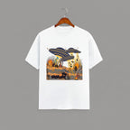 Otherworldly Dino Abduction  Desert graphic t-shirt on WHITE unisex 100% cotton crew neck, unique eye-catching otherworldly desert scene, vibrant detailed artwork high-definition print, DTG print 300 DPI, 180 GSM breathable soft fabric