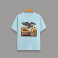 Otherworldly Dino Abduction  Desert graphic t-shirt on BABY BLUE unisex 100% cotton crew neck, unique eye-catching otherworldly desert scene, vibrant detailed artwork high-definition print, DTG print 300 DPI, 180 GSM breathable soft fabric