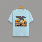 Otherworldly Dino Abduction  Desert graphic t-shirt on BABY BLUE unisex 100% cotton crew neck, unique eye-catching otherworldly desert scene, vibrant detailed artwork high-definition print, DTG print 300 DPI, 180 GSM breathable soft fabric