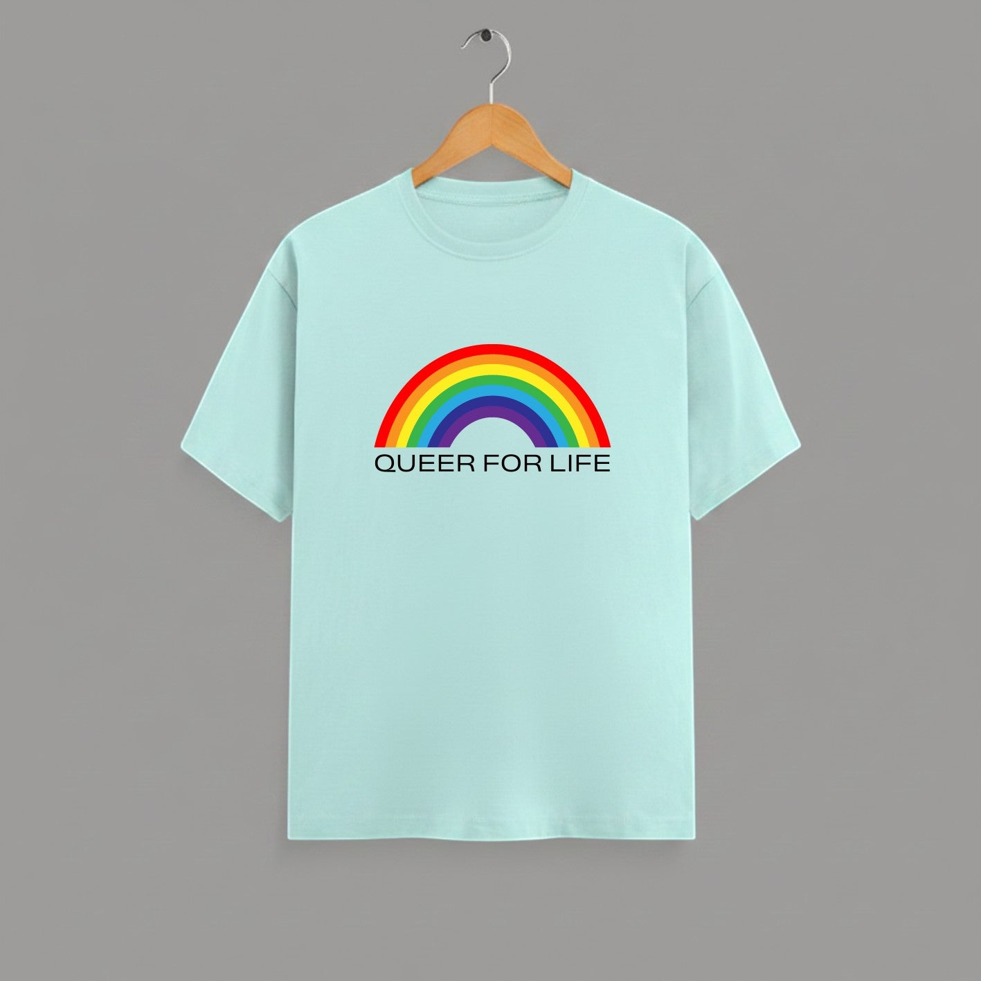 QUEER FOR LIFE graphic t-shirt on MINT unisex 100% cotton crew neck, vibrant high-quality rainbow graphic with QUEER FOR LIFE empowering slogan, pride authenticity statement design, DTG print 300 DPI, 180 GSM breathable soft fabric