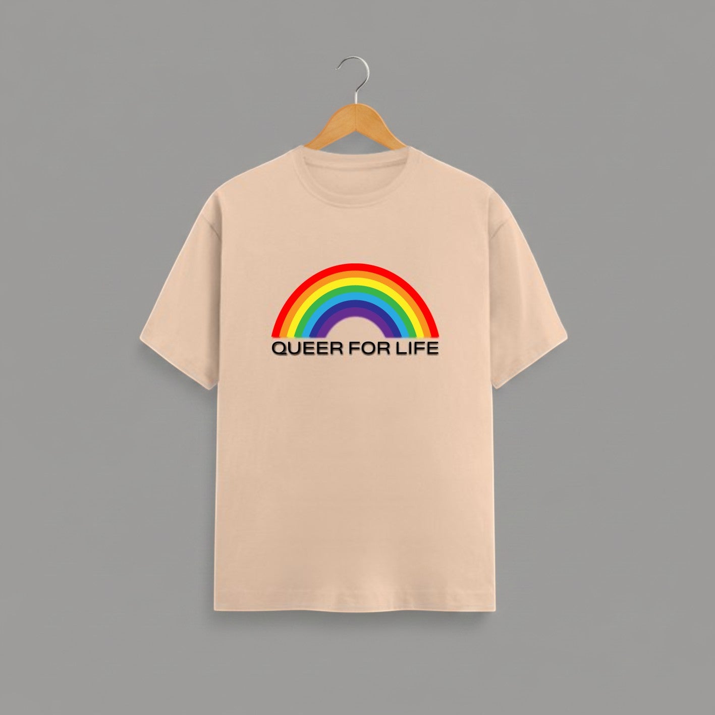 QUEER FOR LIFE graphic t-shirt on PEACH unisex 100% cotton crew neck, vibrant high-quality rainbow graphic with QUEER FOR LIFE empowering slogan, pride authenticity statement design, DTG print 300 DPI, 180 GSM breathable soft fabric