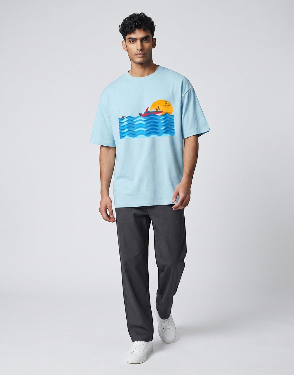 Sunset Boat graphic t-shirt on BABY BLUE unisex 100% cotton crew neck, vibrant high-quality serene sunset boat scene, artistic flair beach design, DTG print 300 DPI, 180 GSM breathable soft fabric