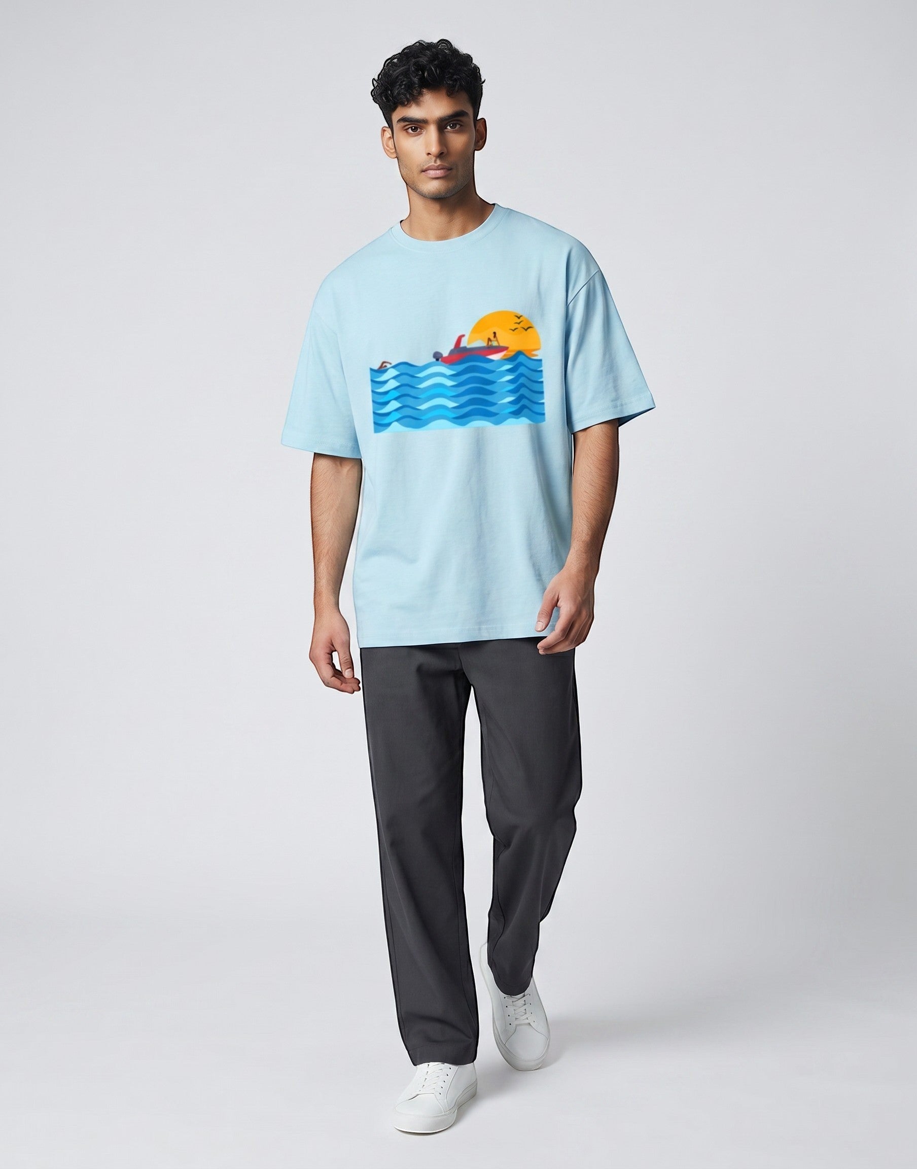 Sunset Boat graphic t-shirt on BABY BLUE unisex 100% cotton crew neck, vibrant high-quality serene sunset boat scene, artistic flair beach design, DTG print 300 DPI, 180 GSM breathable soft fabric