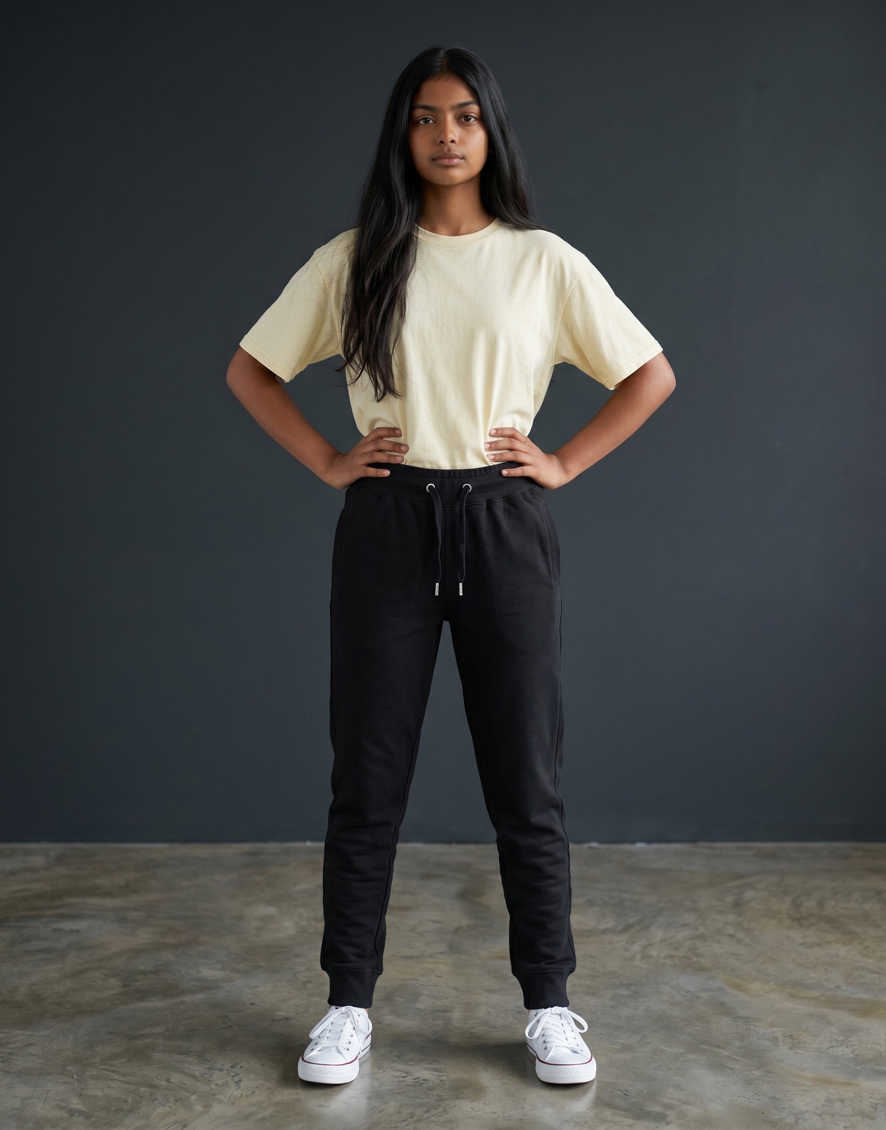 Tribe Neo 91 unisex black cotton fleece joggers with ribbed cuffs and drawstring waist worn by a model