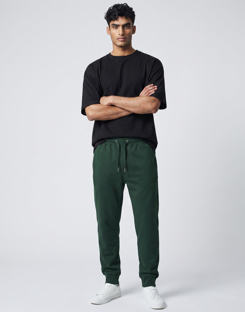 Tribe Neo 91 unisex bottle green cotton fleece joggers with drawstring waist and ribbed cuffs on a male model