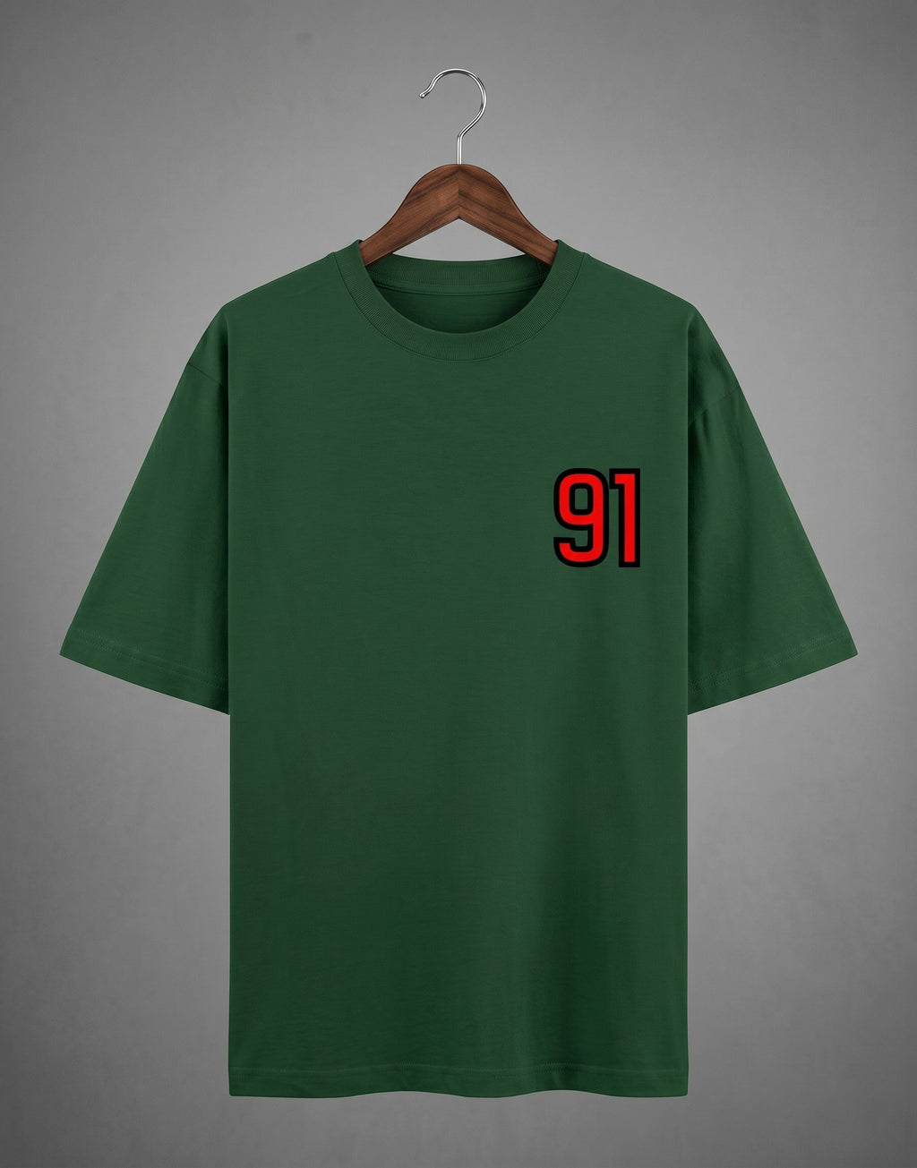 Tribe Neo 91 green heavyweight cotton oversized t-shirt with red and black 91 left chest print on a wooden hanger