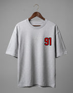 Tribe Neo 91 grey heavyweight cotton oversized t-shirt with red and black 91 left chest print on a wooden hanger