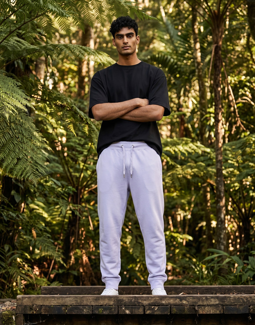 Tribe Neo 91 unisex lavender joggers with ribbed cuffs and drawstring waist worn by a man in a forest setting