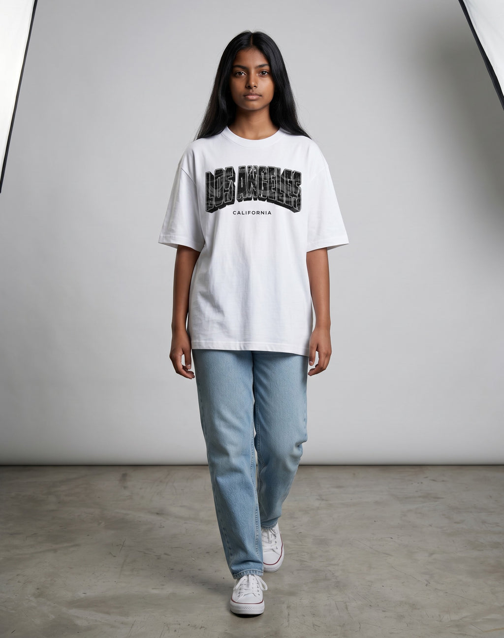 Tribe Neo 91 white oversized cotton t-shirt with Los Angeles California graphic print worn by a woman with jeans.