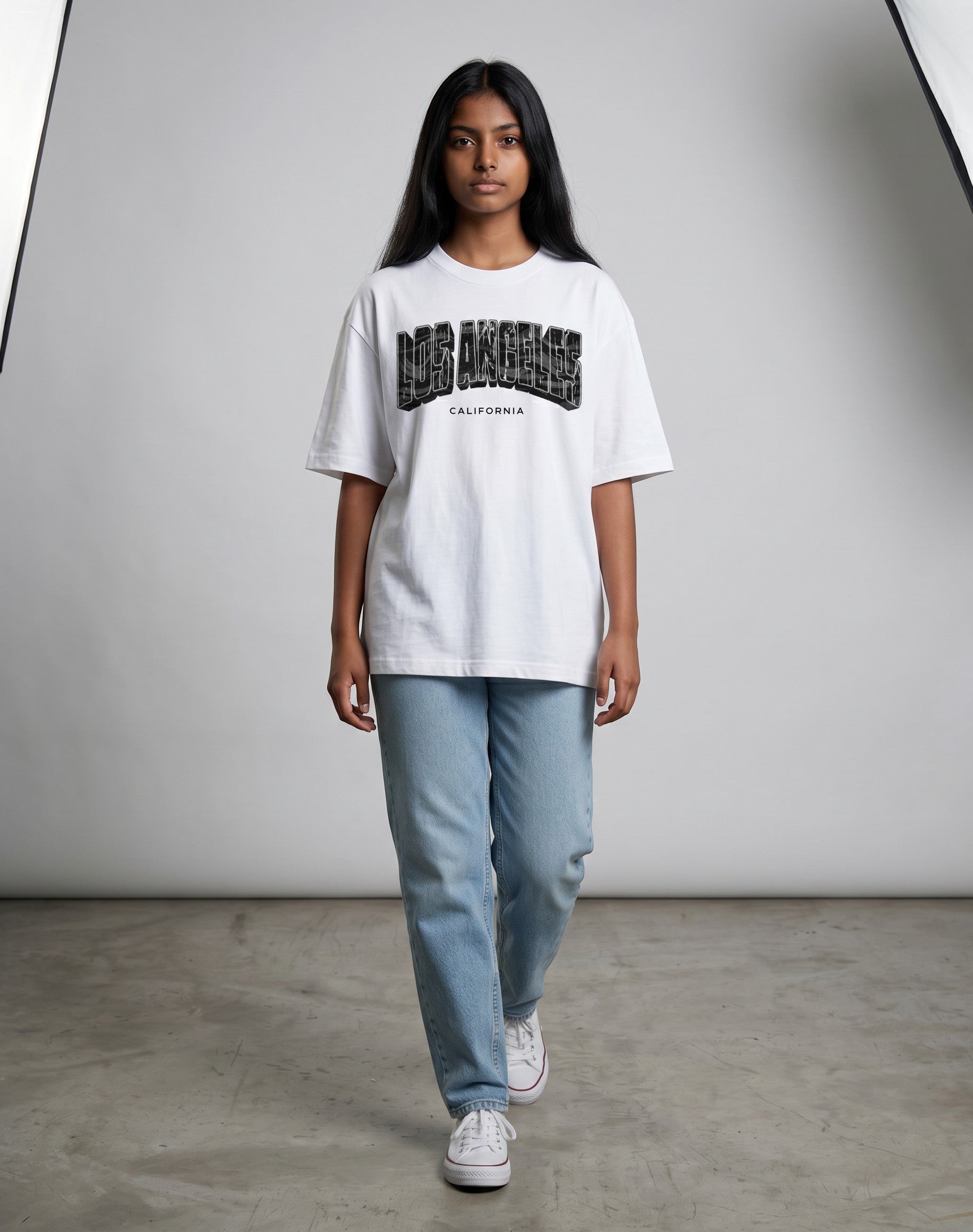 Tribe Neo 91 white oversized cotton t-shirt with Los Angeles California graphic print worn by a woman with jeans.