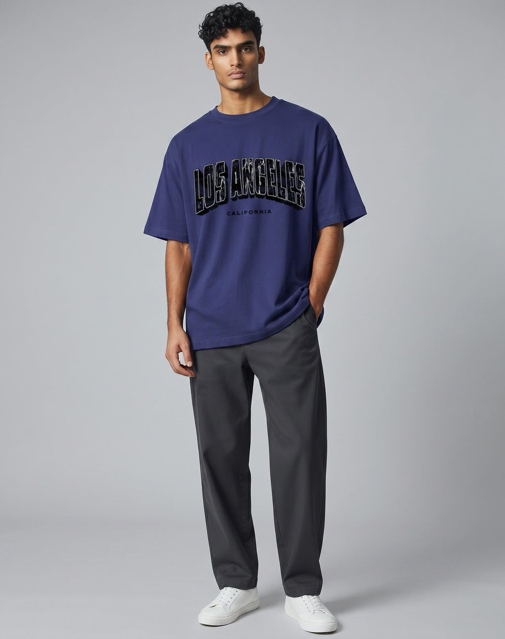 Tribe Neo 91 oversized navy blue cotton t-shirt with distressed Los Angeles cityscape graphic on a male model