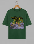 Tribe Neo 91 oversized green cotton t-shirt featuring a comic-style UFO alien invasion graphic print.