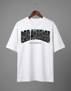 Tribe Neo 91 white heavyweight cotton oversized t-shirt with distressed Los Angeles cityscape graphic print.